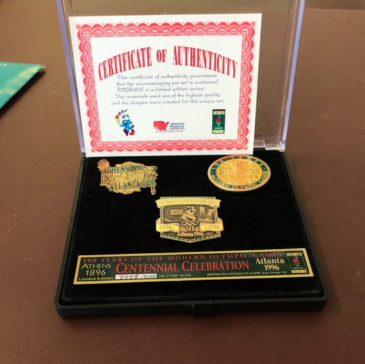 Complete set of four commerative pins and their Certificate of Authenticity
