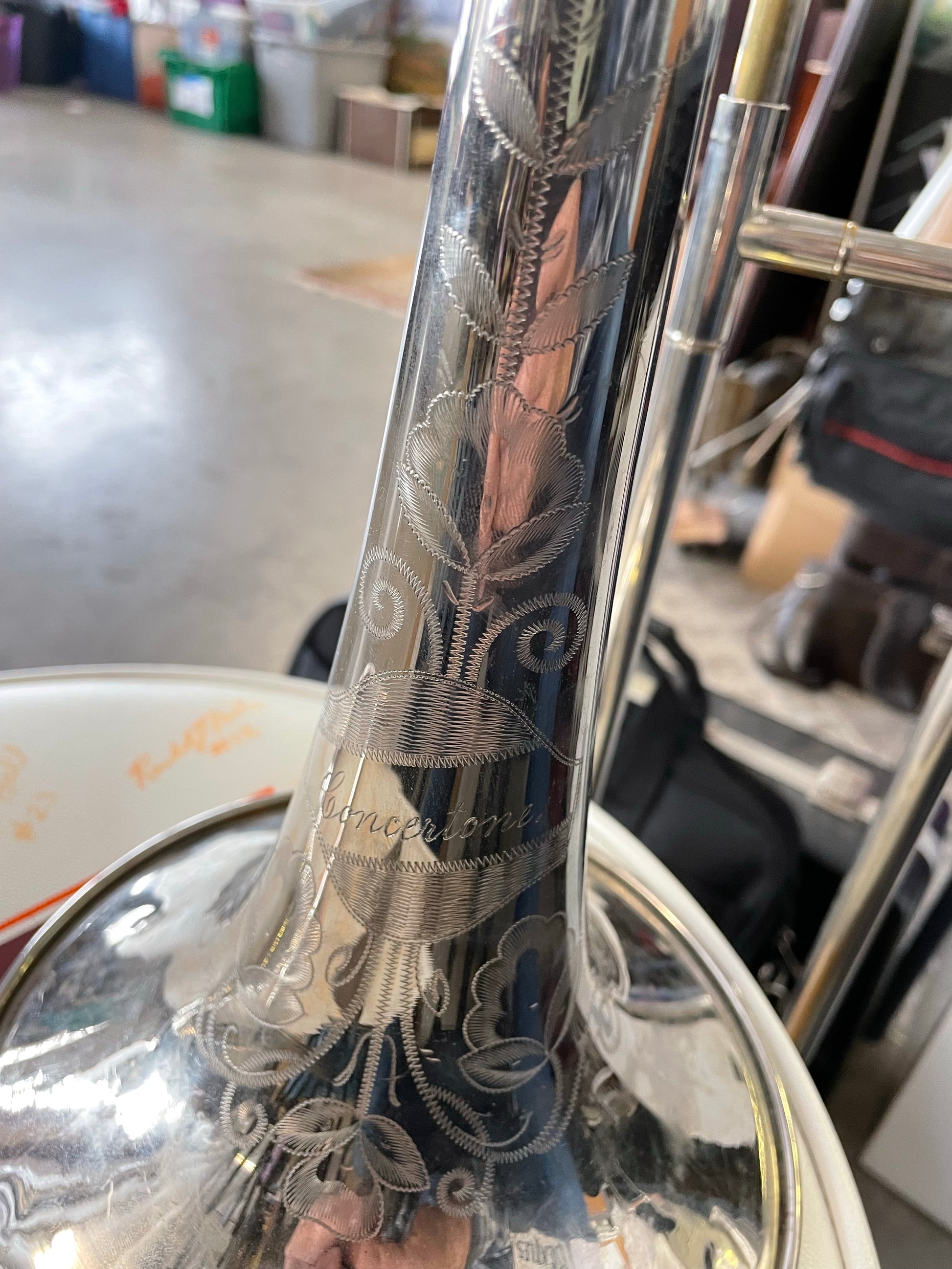 Beautifully engraved design on the bell of the Trombone, a floral design etched into the silver of the trombone.